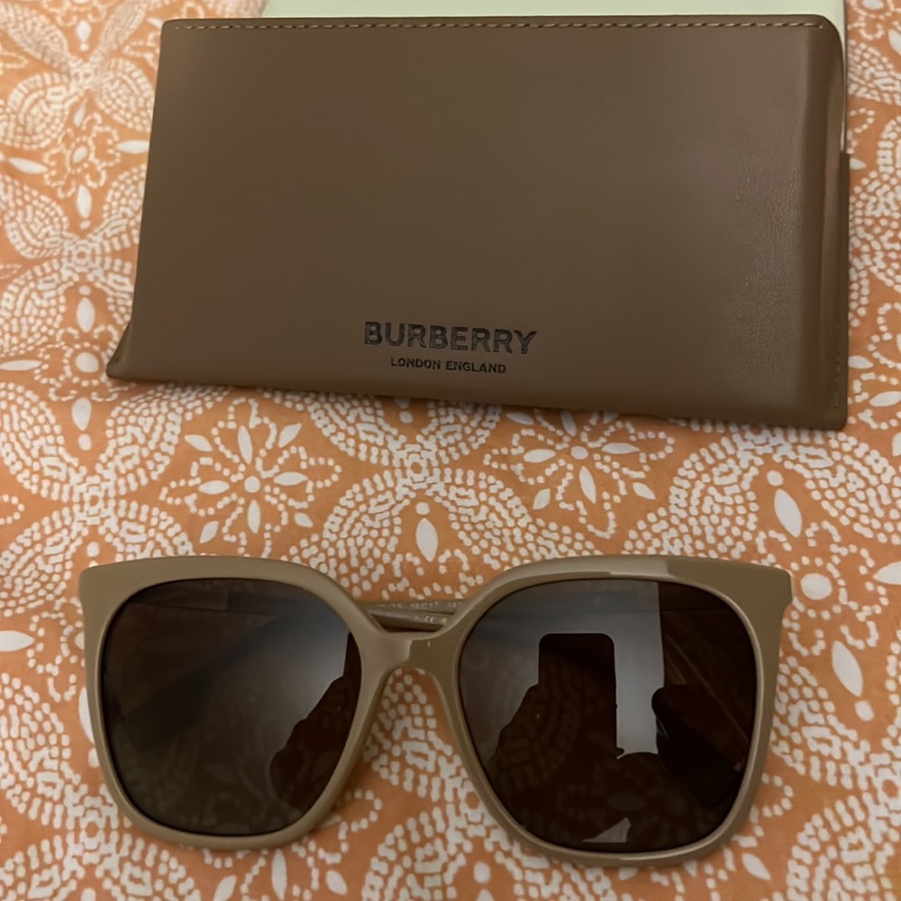 One pair of Burberry Tan Women Sunglasses.